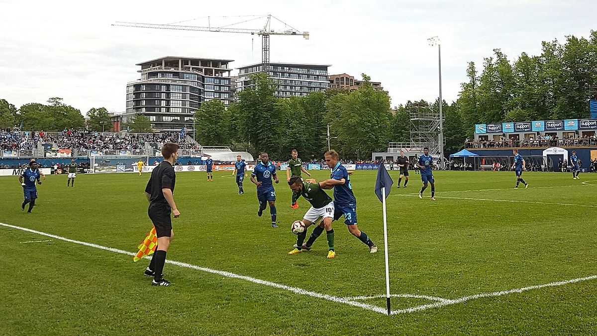 Sergio Camargo (#10, Cavalry FC) disputing the ball with Matthew Arnone (#23, HFX Wanderers FC) during a Canadian Premier League at Wanderer