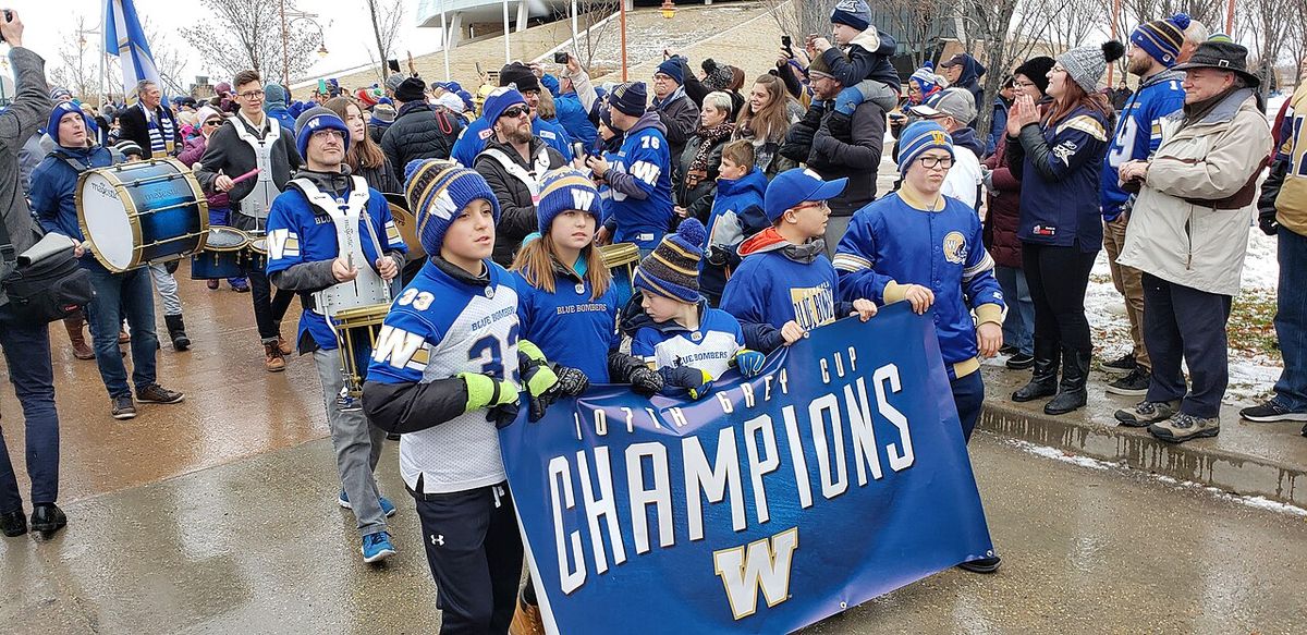 Marchers at the 2019 Grey Cup parade for the Winnipeg Blue Bombers in Winnipeg.