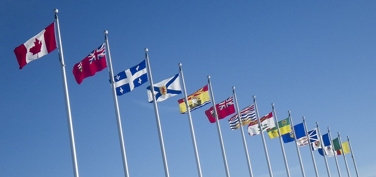 Outside the Canadian War Museum, the provincial and territory flags of all thirteen provinces and territories.