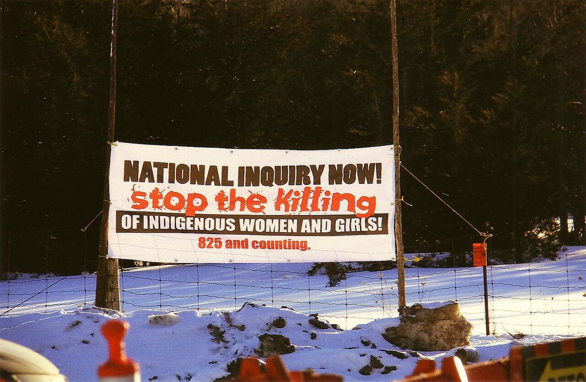 "NATIONAL INQUIRY NOW! stop the killing OF INDIGENOUS WOMEN AND GIRLS! 825 and counting" Sign displayed at a protest held on 4 March 2014 on