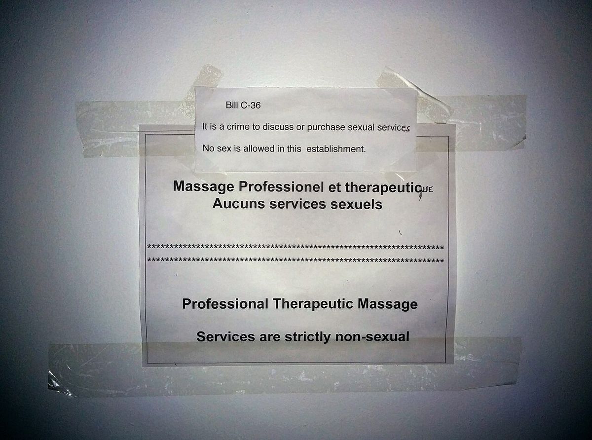 A sign in a room in an erotic massage parlor of Montreal refers to the controversial Bill C-36 (Protection of Communities and Exploited Pers