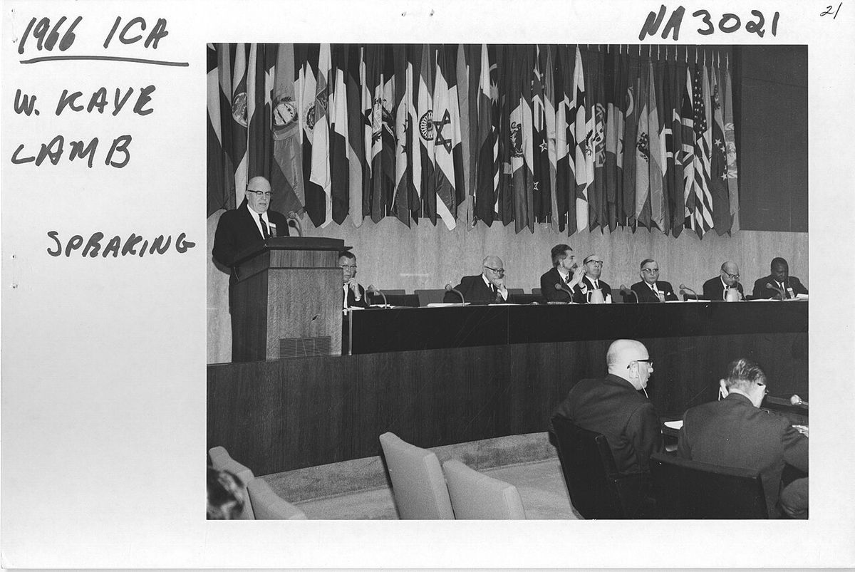 This is a photograph from the Extraordinary Congress of the International Council on Archives. W. Kaye Lamb of Canada is speaking.