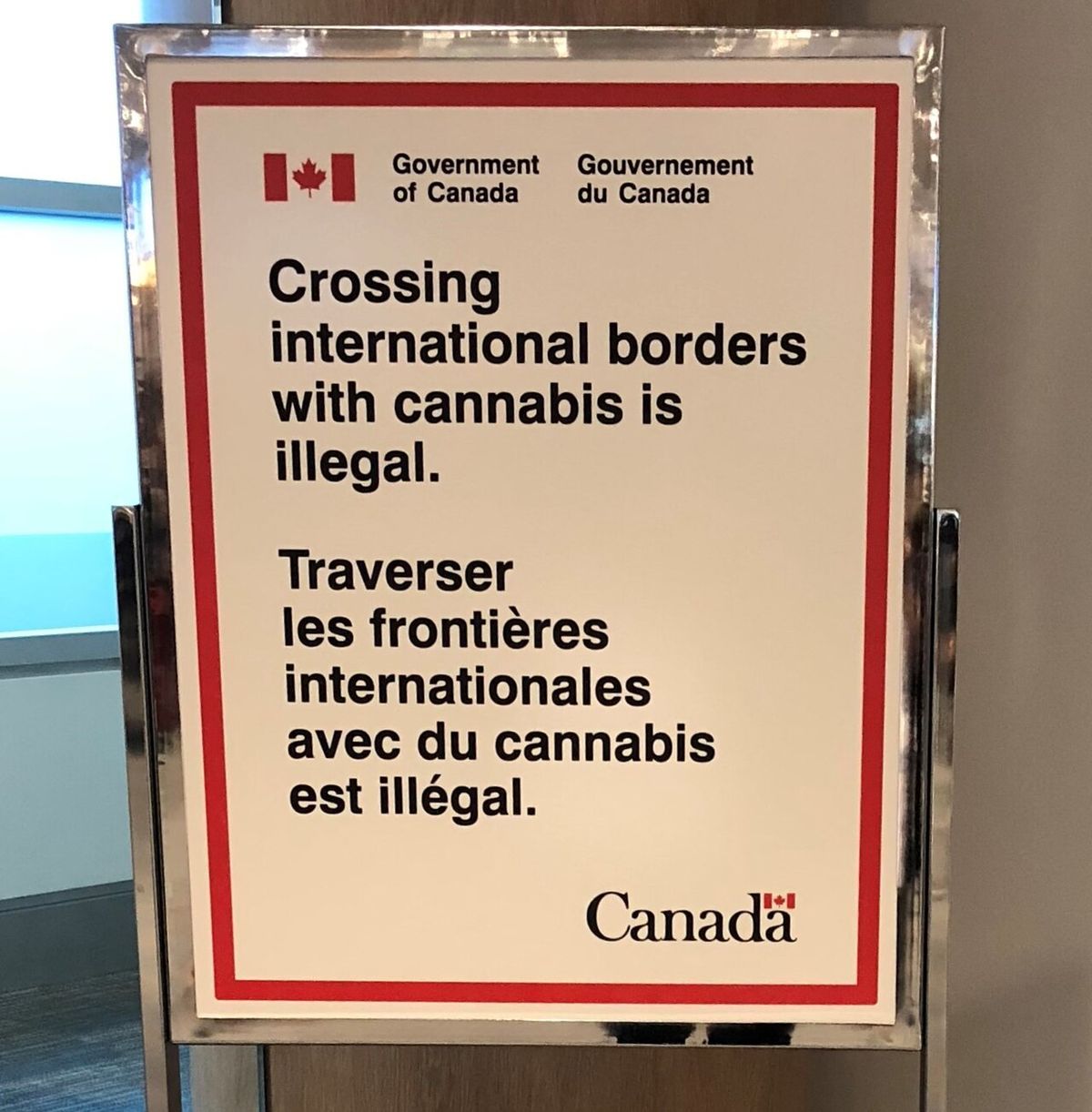 Signage displayed at flight departure gates, at Billy Bishop Toronto City Airport (YTZ) for each outbound United States destination, on 19 O