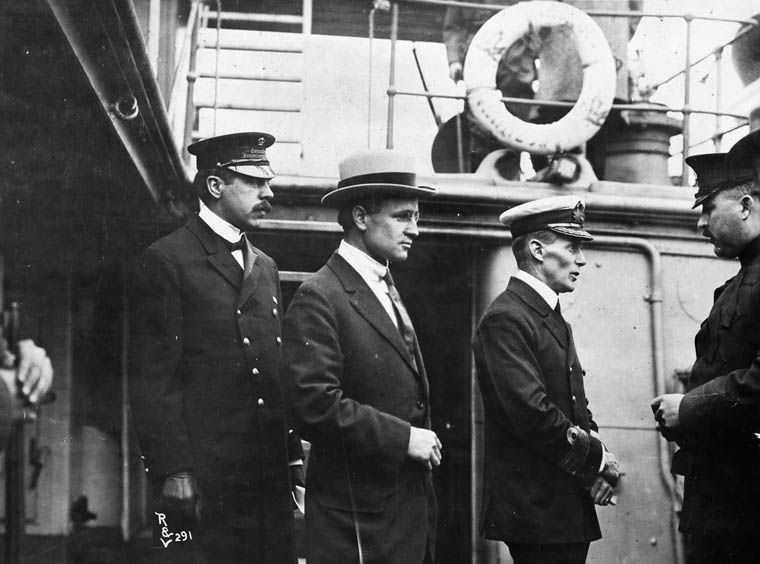 (L-R:)Inspector Reid, H.H. Stevens and Capt. Walter J. Hose on board the "Komagata Maru" in English Bay, Vancouver, British Columbia