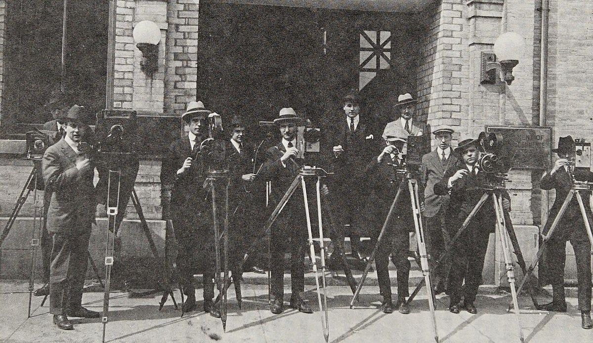 A group of cameramen who work for the Canadian Government Motion Picture Bureau in 1925. Frank Badgley (right), the director of the bureau,