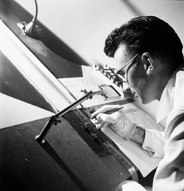 Norman McLaren, of the animation department, National Film Board of Canada, drawing directly on film