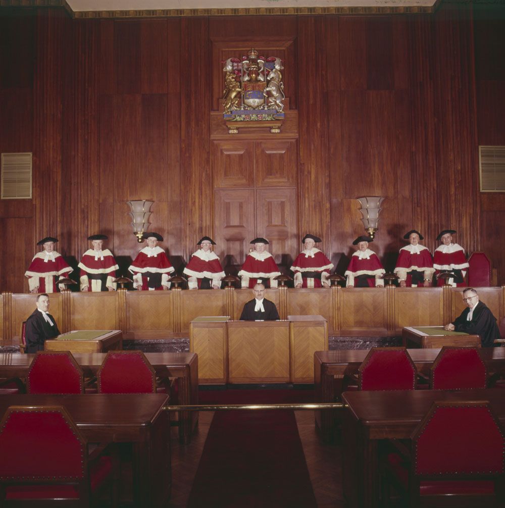 Nine members of the Supreme Court of Canada pose for a photograph.