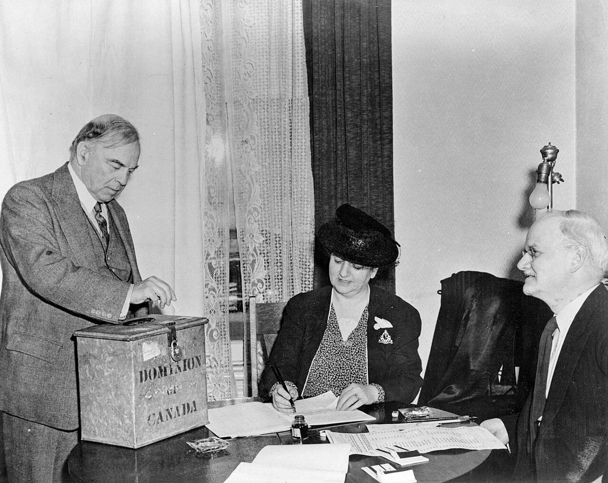 Rt. Hon. Willam Lyon Mackenzie King voting in the plebiscite on the introduction of conscription for overseas military service.