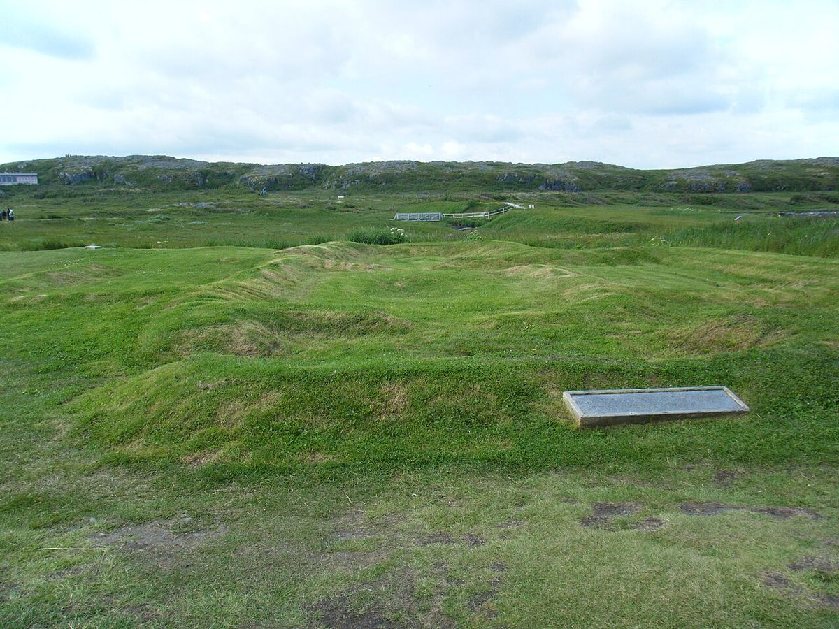 Photograph of the largest original Viking building in L'Anse aux Meadows, Newfoundland. The entryway is in front, the sleeping quarters in t