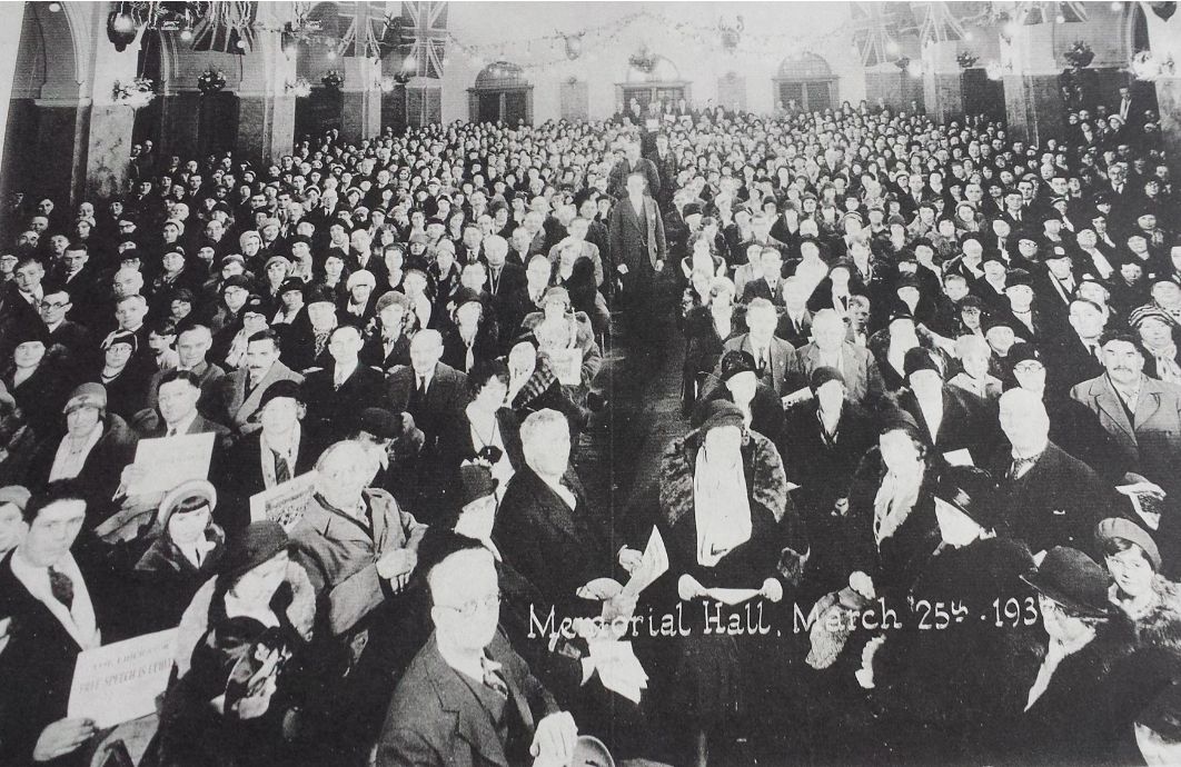 1931 Ku Klux Klan convention in the Royal Canadian Legion's Memorial Hall. Edmonton Alberta, Canada. Figure at bottom center wearing glasses