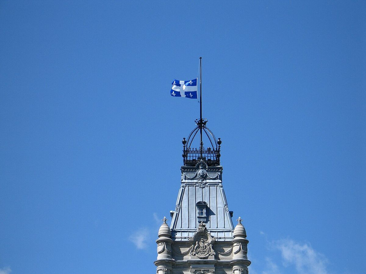 The Government of Quebec ordered all Quebec flags on government buildings, including the Parliament Building in Quebec City (photo), to be l