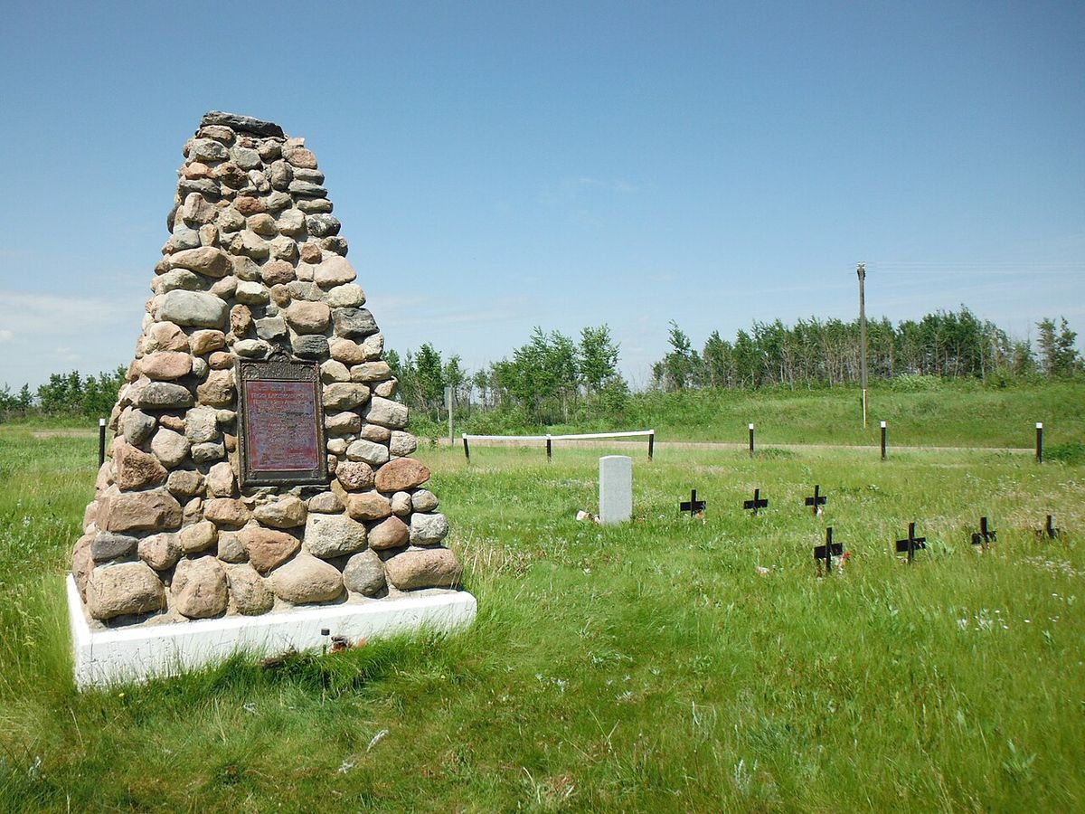The cairn commemorating the Frog Lake Massacre located in the cemetery with the graves of some of those who were killed. Frog Lake National 