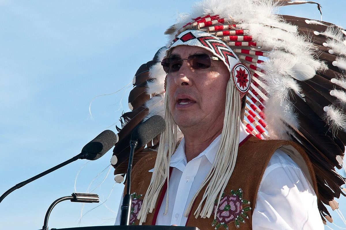 Chief Wilton Littlechild, wearing his Honourary Chief headdress, speaking at a Truth and Reconciliation Commission event in Inuvik, 2011.