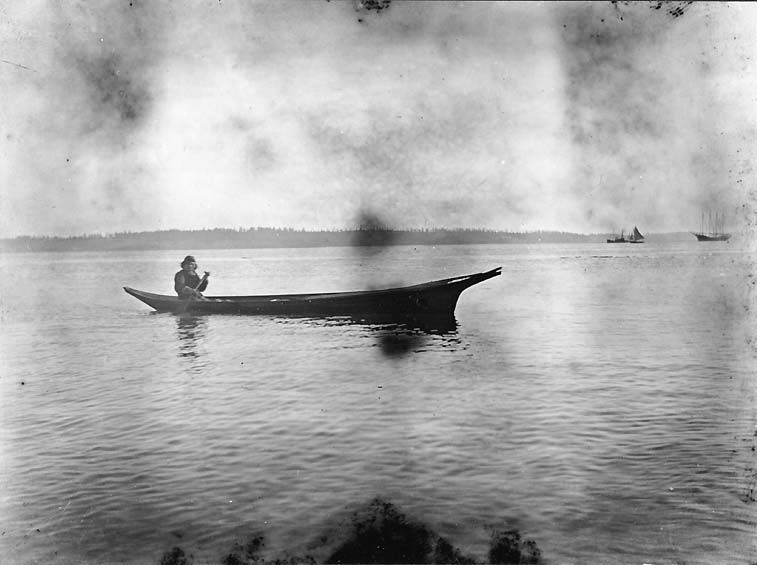 Coast Salish canoe in Port Townsend Bay, ca. 1900 by McCurdy, James G. American Memory from the Library of Congress