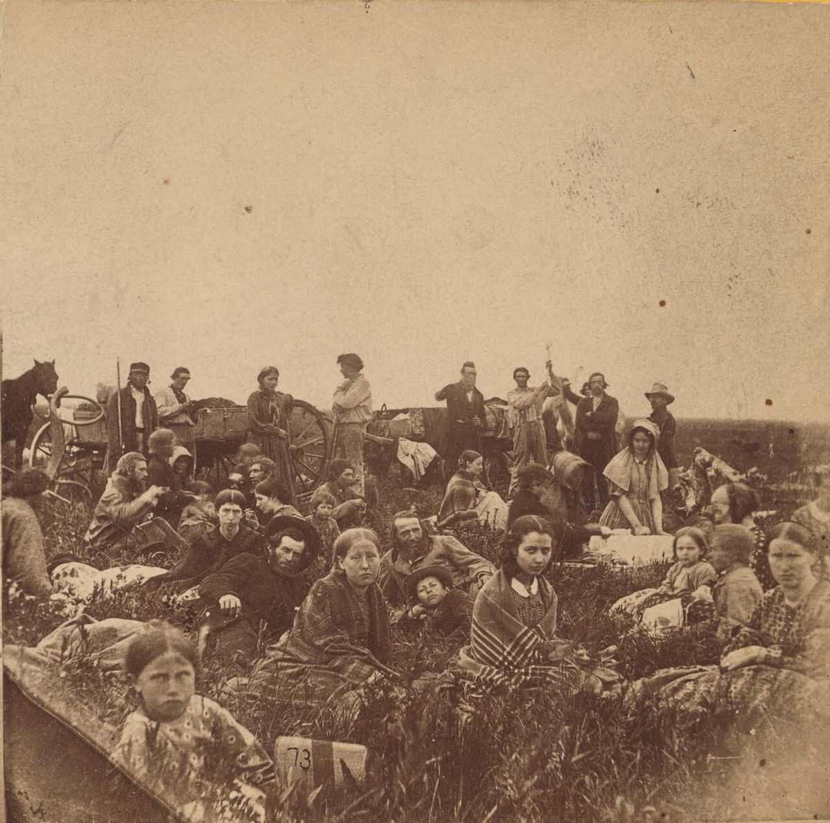 Title: "People escaping from the Indian massacre of 1862 in Minnesota, at dinner on a prairie". Photo shows the U.S.-Dakota War of 1862. Rig