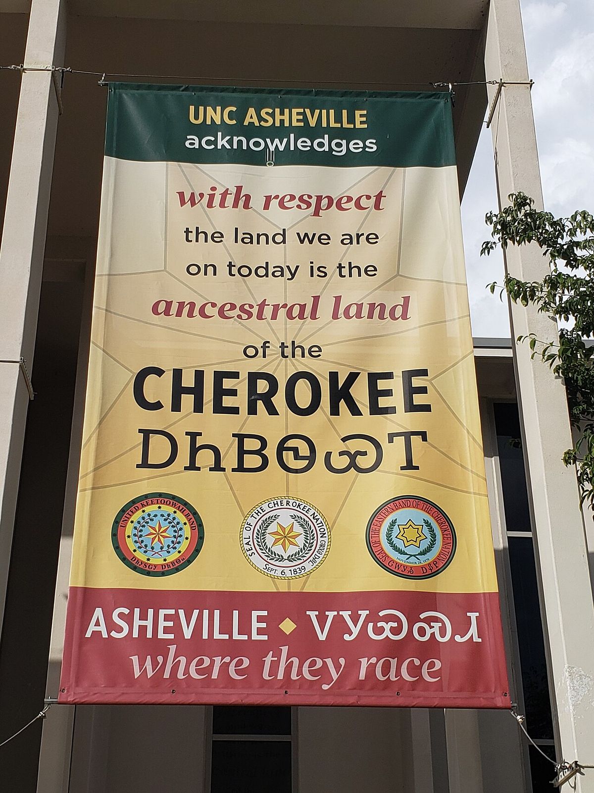 A banner at UNC Asheville acknowledging the Cherokee as the indigenous people of the Asheville area.