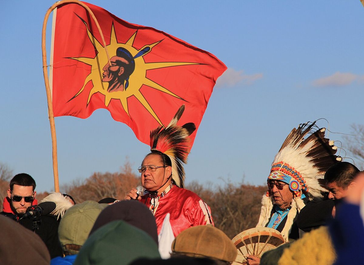 Beyond NoDAPL March on Washington, DC. Native American speaker with his father and a drum.