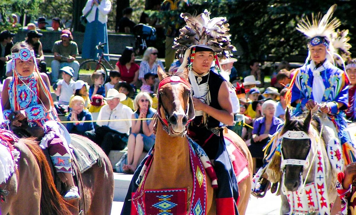 Tsuu T'ina children in traditional costume at a Stampede Parade.