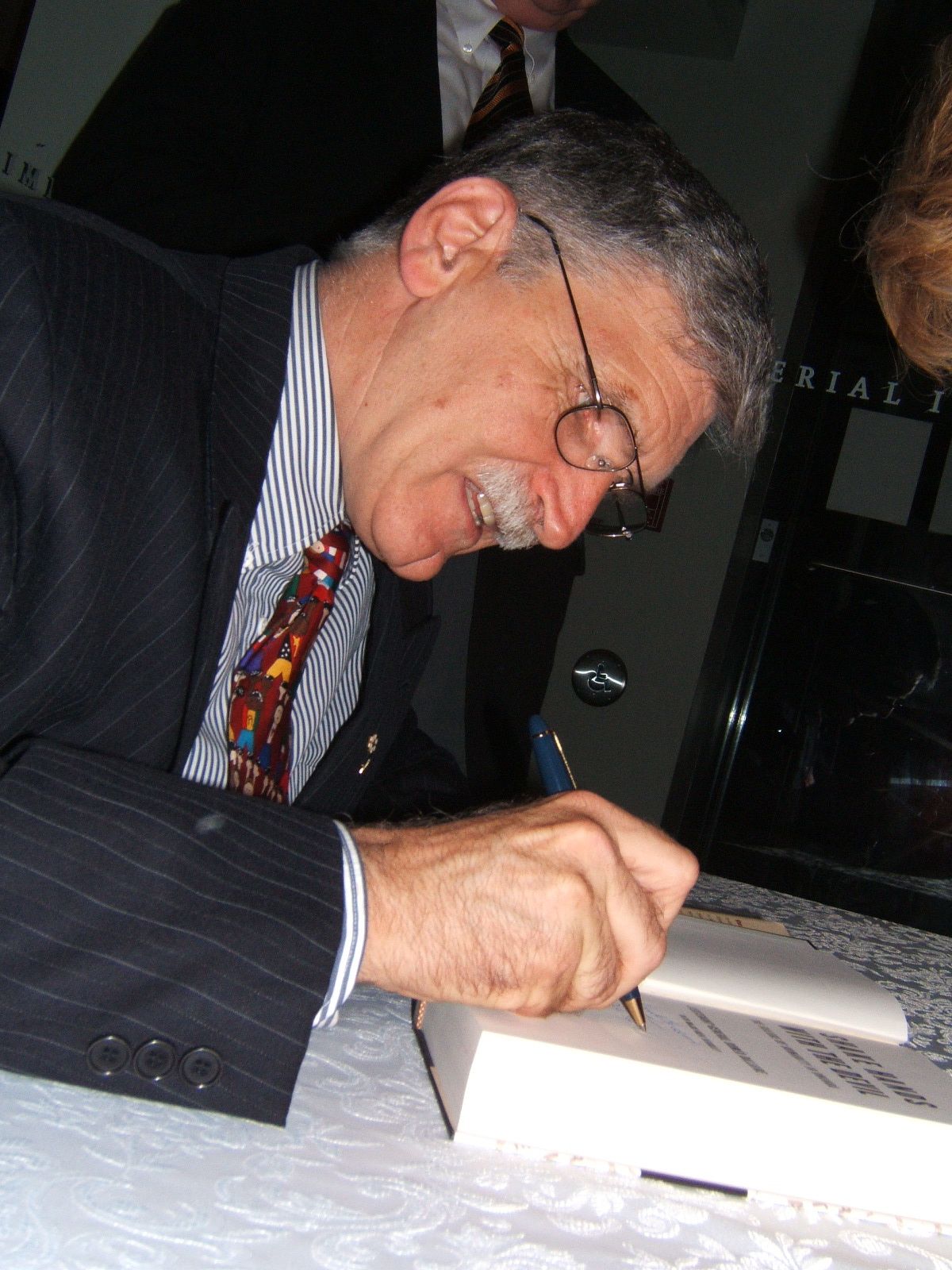 Roméo Dallaire signing a book
